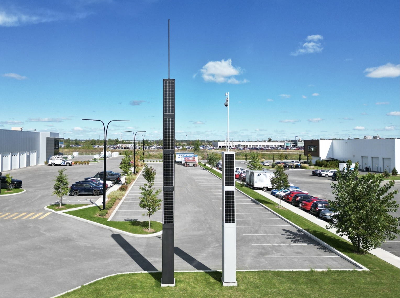 Black-painted MS4 and natural-finish MS2 Monolith solar power units installed side by side